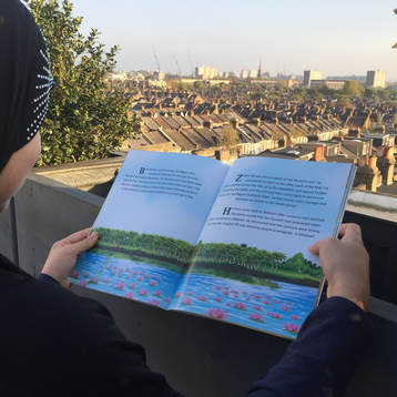 Girl reading ADaBi books in London. Islamic books for kids